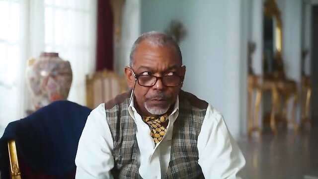 Elderly black man in suit and bowtie, Rubi Rose sexy music clip celeb