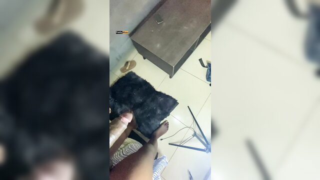 Amateur POV closeup of cock over woman's black furry rug foot tease