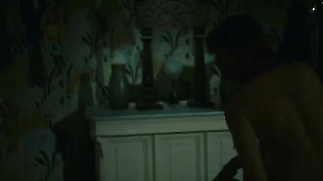 Sylvia Kristel nude back view in dark bedroom scene