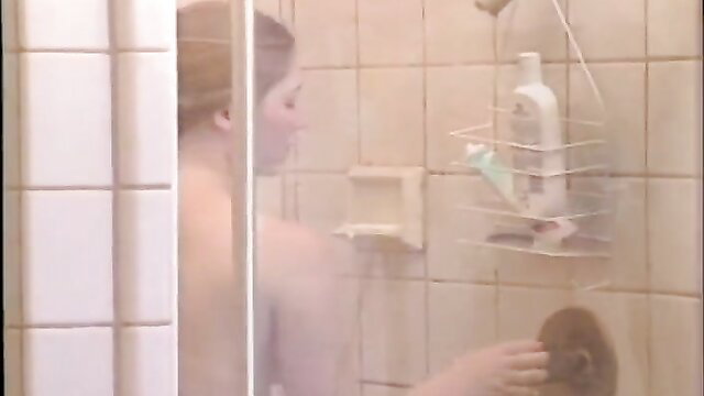Beautiful teen showering nude, soapy body in steamy bathroom