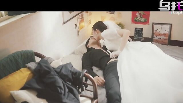 Asian wedding bride in white dress passionately kisses ex on bed