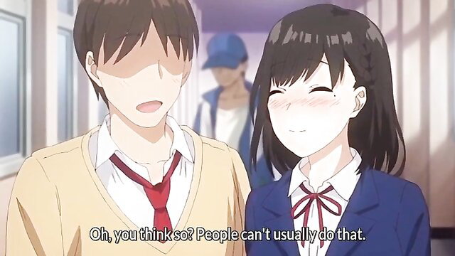 Cute Japanese teen girl smiles blushing with boy in school uniforms