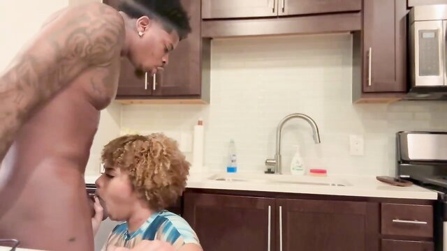 Curly haired ebony teen sucking BBC in kitchen blowjob