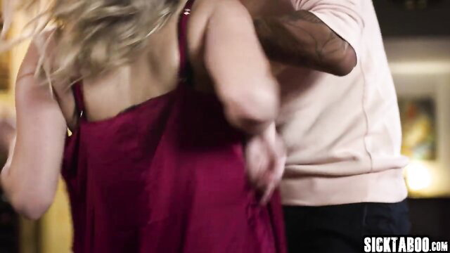 Cadence Lux in red dress dances intimately with tattooed man