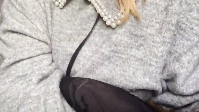 Blonde in pearl collar sweater gives risky plane handjob