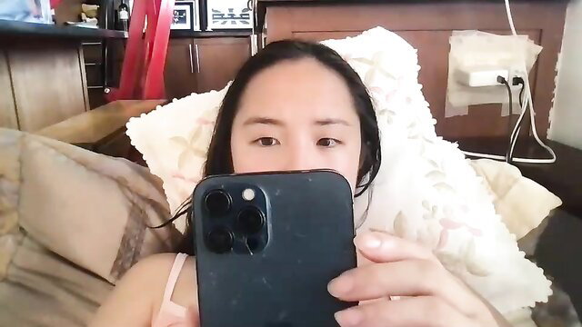 Chellybear101 sexy selfie on bed, cleavage in tank top, asian beauty