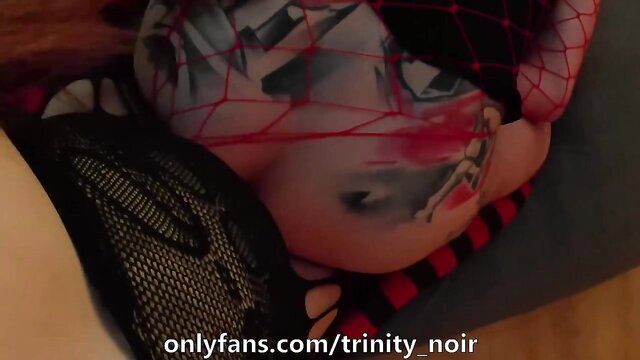 Trinity Noir in fishnet lingerie, seductive pose on OnlyFans