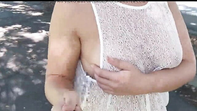 Busty amateur babe flashes huge tits in sheer lace top outdoors