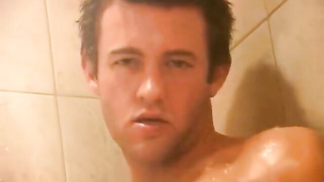 Hot shirtless guy Blake in shower, wet skin glistening