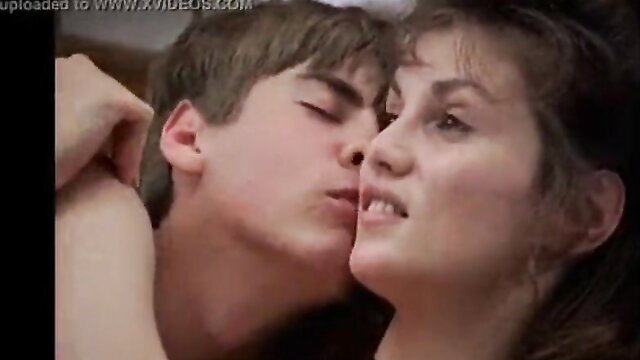 Young stud passionately kisses busty aunt in steamy movie scene