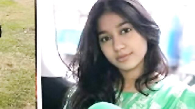 Pretty young Indian student in green salwar kameez smiles closeup