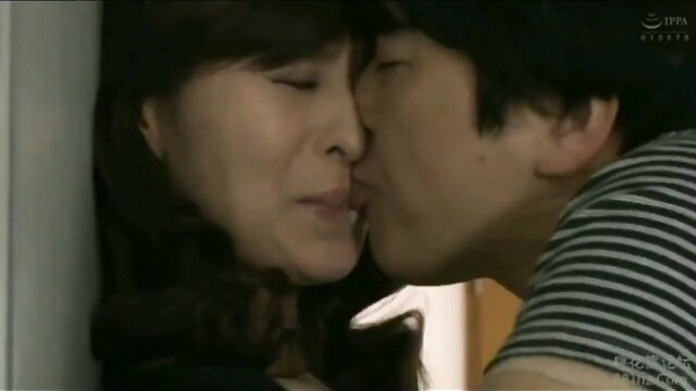 Japanese mother-in-law in mourning dress passionately kisses young man