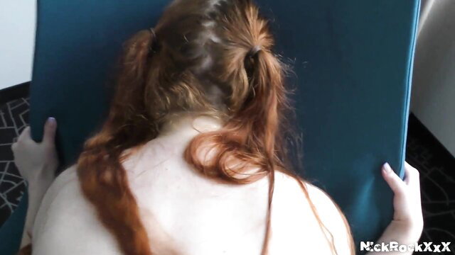 Redhead teen bends over blue mat, nude back view, first time dick handjob