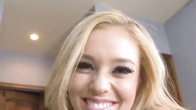 Hot blonde stepdaughter smiling seductively closeup