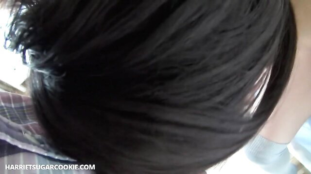 POV closeup of Japanese teen's black hair and plaid collar in JAV creampie scene