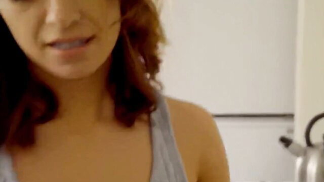 Hot redhead step sis in tank top smiles teasingly in kitchen