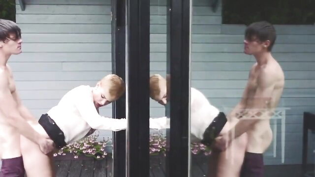 Twin muscular young men groping in tight briefs outdoors mirror