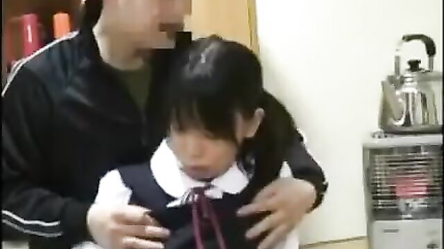 Asian teacher gropes cute Japanese schoolgirl in uniform closeup