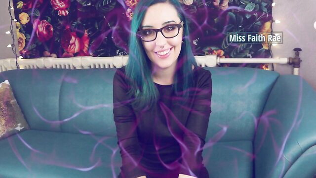 Miss Faith Rae teal-haired femdom in black top on couch