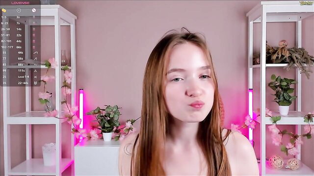 Reaganprigg sexy redhead baby pouting in pink neon lit tits tease