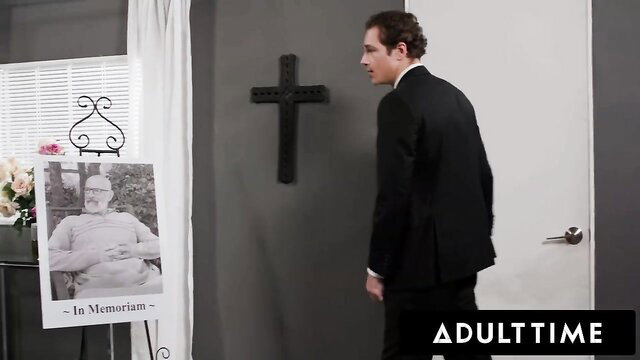 Ruby Lynne at memorial service in suit, In Memory photo, AdultTime