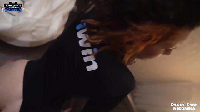 Darcy Dark in tight black WIN top, teasing ass up view