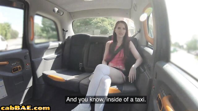 Redhead babe in stockings flashes in taxi cab