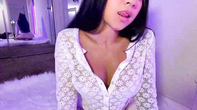 Mimibabyxxx young Asian camgirl in lace top, teasing cleavage