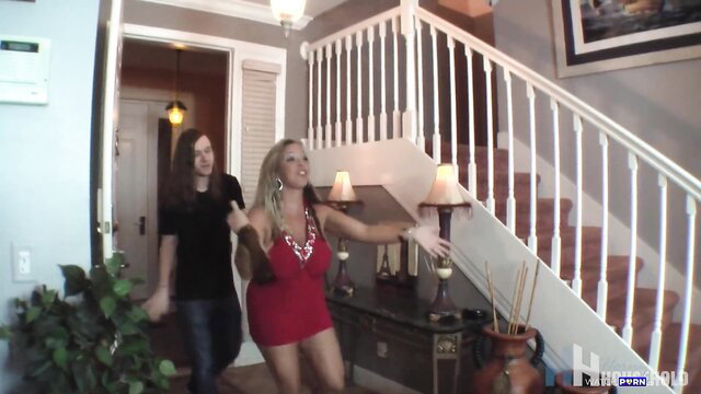 Amber Lynn Bach and busty blonde in red mini dress at home party