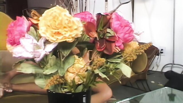 Silvia Saint with vibrant flower bouquet closeup