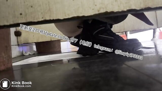 Asian girl squats low over toilet shitting, shoes visible