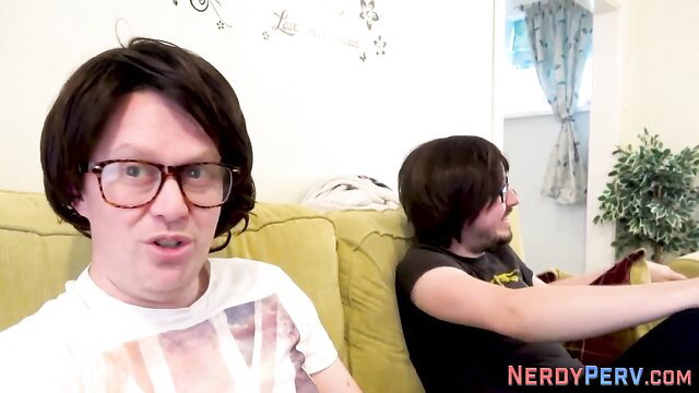 Two nerdy guys on couch in amateur gay preview thumbnail