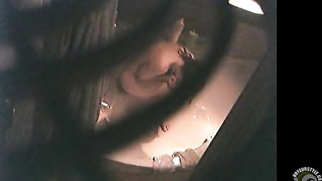 Hidden cam captures busty amateur masturbating in bathtub to real orgasm