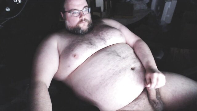 Chubby bearded bear stroking thick cock solo jerkoff