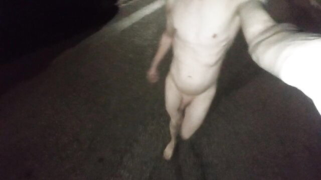 Nude man walking undressed in dark public street amateur exposure