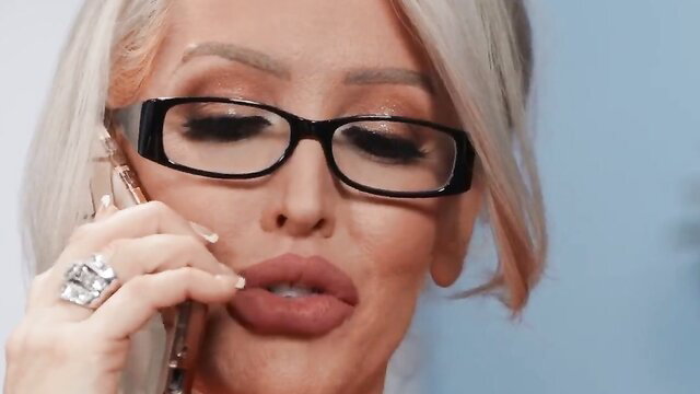Alura TNT Jenson with plump lips on phone call in glasses