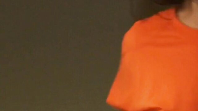 Jynx Maze bubble butt in tight orange top, sexy side profile