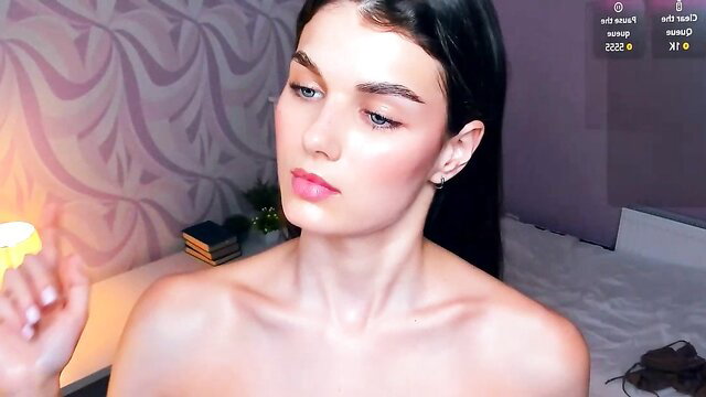 Dark-haired topless camgirl Candy Flo holds flower nude