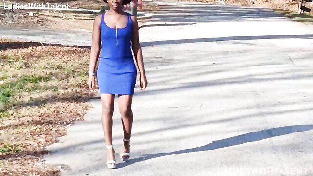 Sexy black babe in tight blue zip dress walks streets in heels