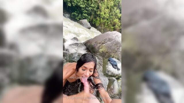 Laura Saenz giving blowjob in river, wet nude brunette outdoors