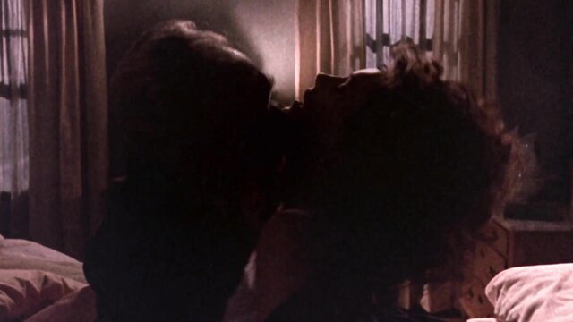 Bonnie Bedelia as Polly Chalmers kissing passionately in bed, Needful Things 1993