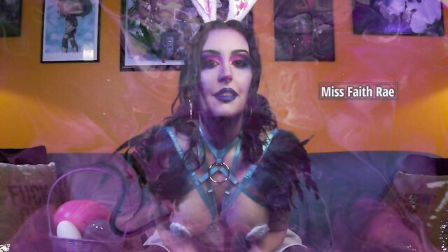 Miss Faith Rae in sexy bunny femdom outfit with harness and feathers