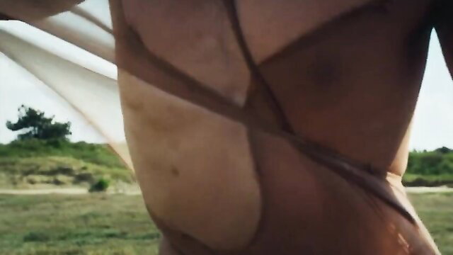 Clara de Lluvia nude tits in Corps et ames (2022) sheer fabric beach tease