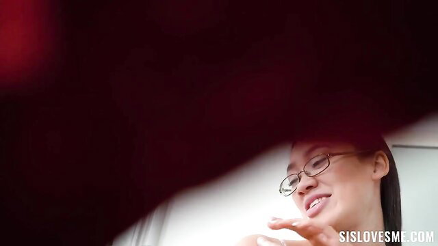 Exotic Asian sister in glasses smiles seductively from below POV
