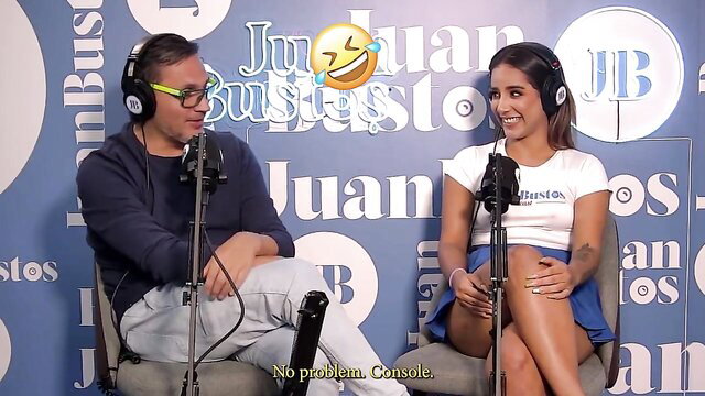Natalia Garcia on Juan Bustos Podcast in tight top and miniskirt