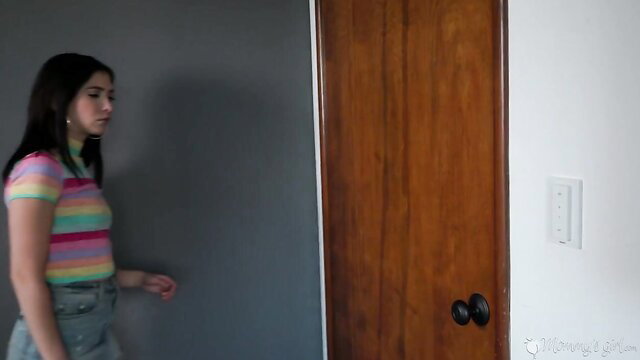 Brunette teen in striped top and jeans walks to door in stepmom seduction