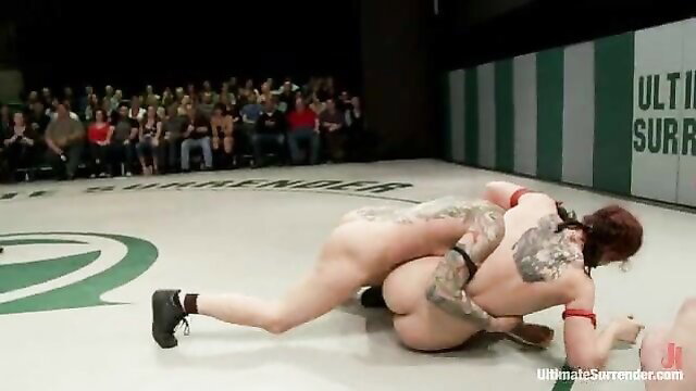 Naked tattooed redhead girls in lesbian wrestling match, nude grappling action