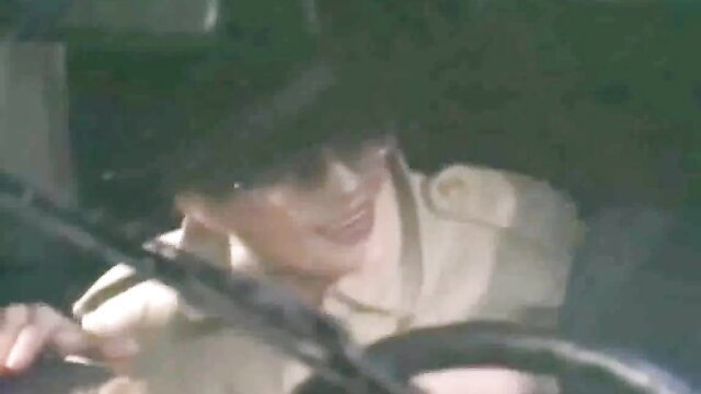 Asian man in uniform driving car POV, tense parking lot tease