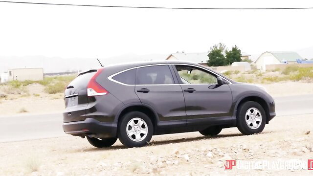 Chanel Preston in grey Honda CR-V on desert road