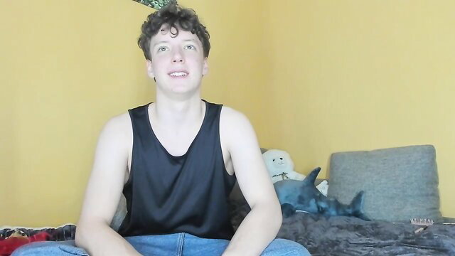 emily0303 Chaturbate cam boy in tank top, plush toys background